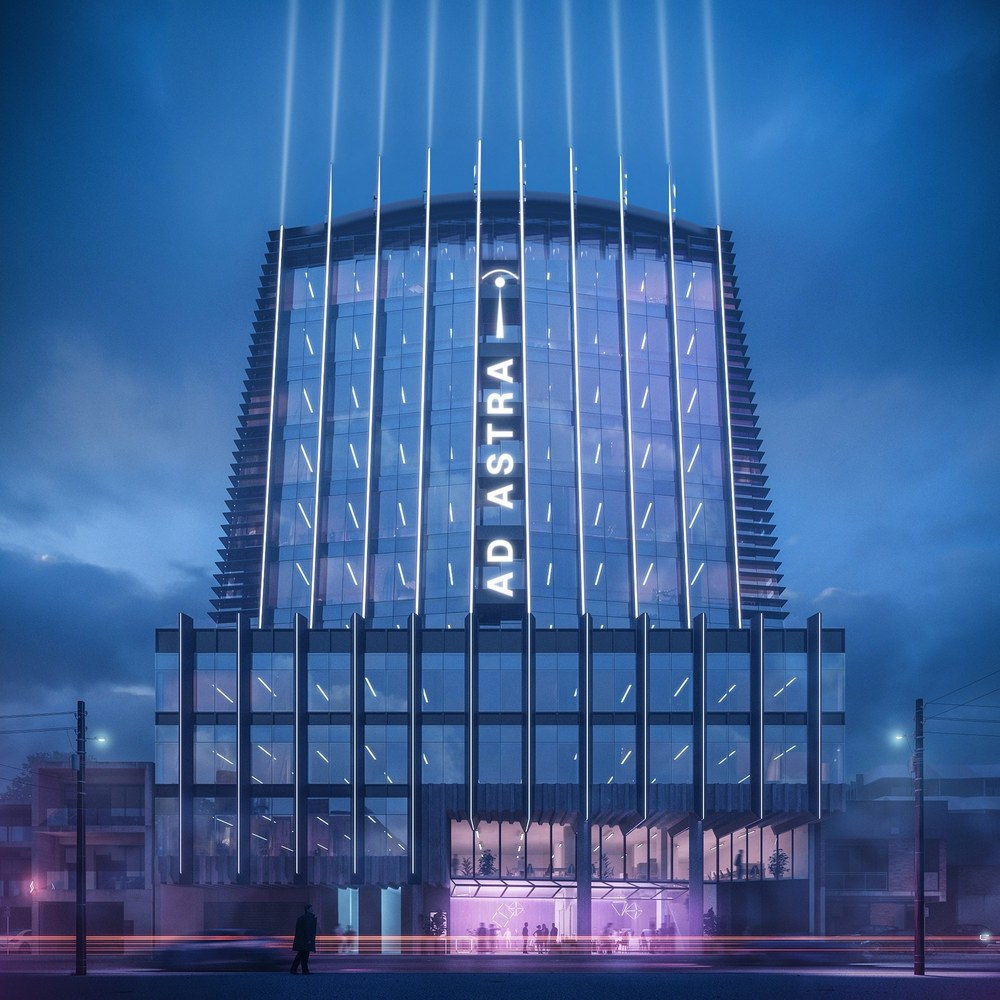 Ad Astra at 51-57 Cubitt Street, Cremorne, at night, the name lit up the centre of the tower